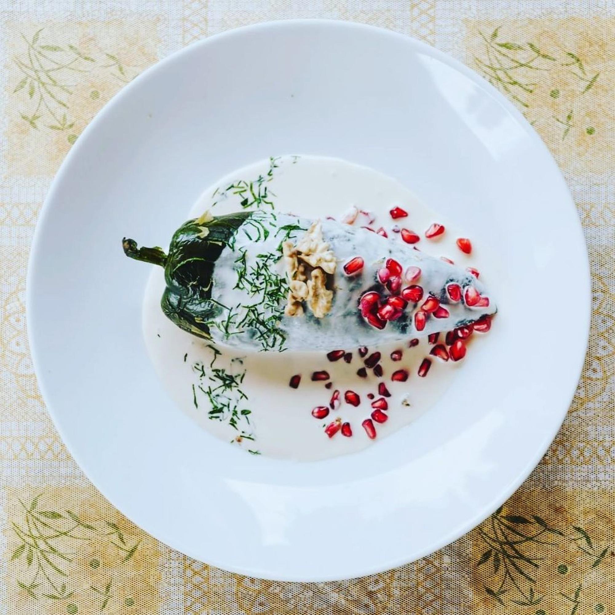 Close-up of plated seasonal dish on wooden table